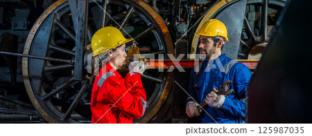 Engineer checking construction process railway and checking work on railroad station  125987035