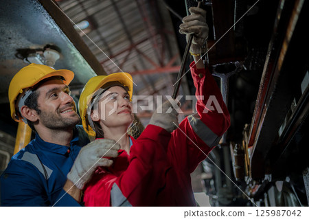 Engineer checking construction process railway and checking work on railroad station  125987042