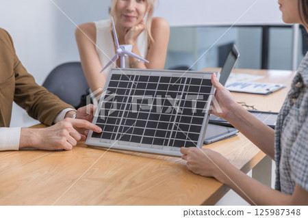 Business person meeting on solar cell panel technology. Business person meeting on solar cell panel technology. 125987348