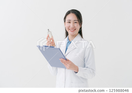 A researcher smelling perfume 125988046