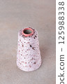 Yarn with sequins. Yarn on bobbin. Hobby concept. Knitting or crocheting. Handmade work. 125988338