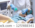Child is under anesthesia. Treatment of baby teeth under general anesthesia. Breathing tube is inserted into child's throat. Concept of healthcare. 125988341
