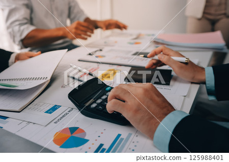 Team of financial advisory services. Asian advisor showing plan of investment to clients in the consultancy office. Team of financial advisory services. Asian advisor showing plan of investment to clients in the consultancy office. 125988401