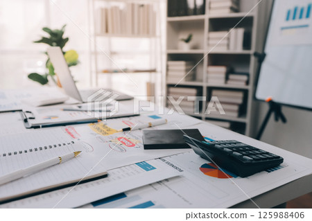 Team of financial advisory services. Asian advisor showing plan of investment to clients in the consultancy office. Team of financial advisory services. Asian advisor showing plan of investment to clients in the consultancy office. 125988406