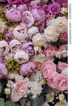 floral arrangement showcasing delicate peonies, roses, and greenery in colorful display. closeup. 125989093