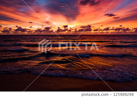 Nature beautiful light sunset or sunrise over sea surface,Colorful sunset sky with clouds and waves in the ocean,Wide angle sea background 125989298