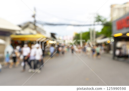 Blur tourists walk in shopping market Chatuchak weekend market in Thailand. 125990598