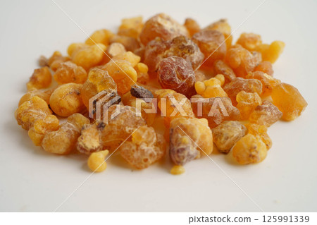 Frankincense or olibanum aromatic resin isolated on white background used in incense and perfumes. Frankincense or olibanum aromatic resin isolated on white background used in incense and perfumes. 125991339