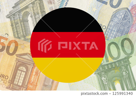 Germany flag on Euro banknotes money, finance investment business. Germany flag on Euro banknotes money, finance investment business. 125991340