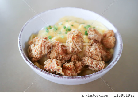 creamy omelet or omelet or omelette or fried egg with fried chicken or crispy chicken or chicken 125991982