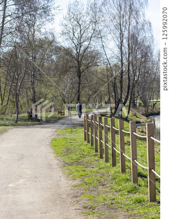 People enjoying first warm days outdoors 125992070