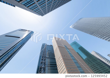 Landscape of the office town looking up at a skyscraper Landscape of the office town looking up at a skyscraper 125993452