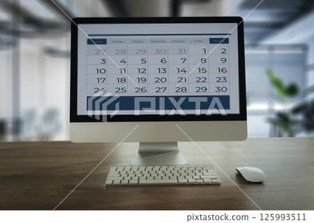 Event planner note on calendar businessman uses her smartphone and laptop to plan events, manage her schedule, and stay connected online Event planner note on calendar businessman uses her smartphone and laptop to plan events, manage her schedule, and stay connected online 125993511