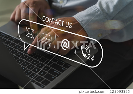 Businessman typing on laptop with contact  125993535