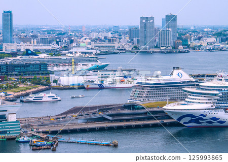 Yokohama cityscape in Japan with three luxury cruise ships: Norwegian Spirit, Riviera, and Diamond Princess Yokohama cityscape in Japan with three luxury cruise ships: Norwegian Spirit, Riviera, and Diamond Princess 125993865