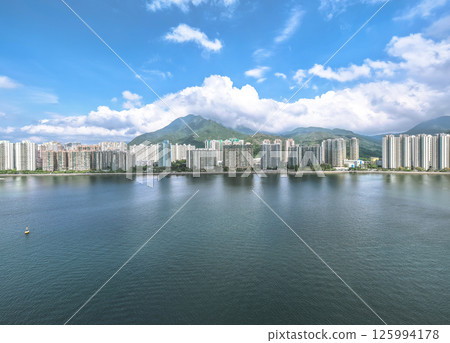 Waterfront Cityscape with High Rise Buildings and a Mountainous Backdrop May 4 2025 Waterfront Cityscape with High Rise Buildings and a Mountainous Backdrop May 4 2025 125994178