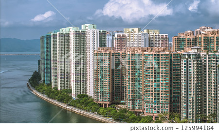 Waterfront Cityscape with High Rise Buildings and a Mountainous Backdrop May 4 2025 Waterfront Cityscape with High Rise Buildings and a Mountainous Backdrop May 4 2025 125994184