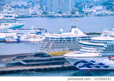 Yokohama cityscape in Japan with three luxury cruise ships: Norwegian Spirit, Riviera, and Diamond Princess 125994201