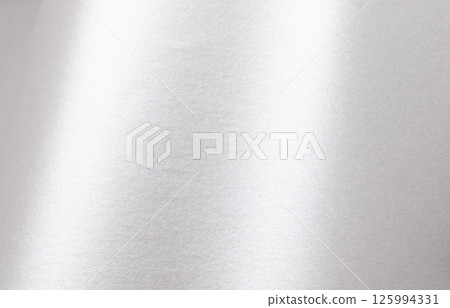 Silver paper texture with pearlescent gloss, shimmering surface and metallic platinum tones, sleek 125994331