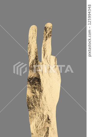 Peace sign with two fingers in golden metallic texture, symbolizing victory, hope, and positivity. 125994348
