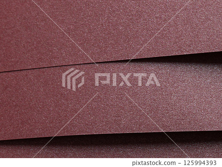 Paper texture with burgundy tone, clean smooth surface and shimmering metallic finish, wine red 125994393