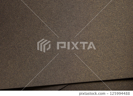 Brown paper texture with premium antique gold and dark gold tones, luxurious glossy surface with Brown paper texture with premium antique gold and dark gold tones, luxurious glossy surface with 125994488