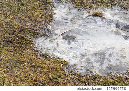 Concept shot of the cracked ice on ground 125994758