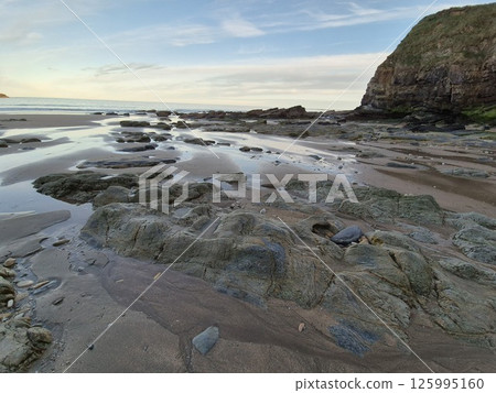 Coastal Water Landscape with Clouds and Beach Coastal Water Landscape with Clouds and Beach 125995160