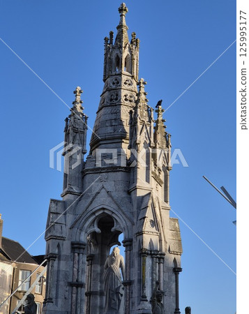 Temple Tower Facade in City Landscape 125995177
