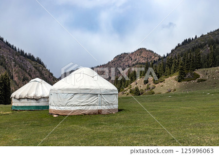 Two yurts in a mountain gorge. Nomad housing 125996063