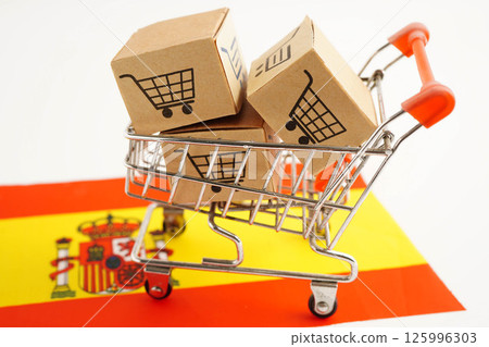 Online shopping, Shopping cart box on Spain flag, import export, finance commerce. Online shopping, Shopping cart box on Spain flag, import export, finance commerce. 125996303