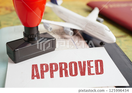 Approved Stamp passport document to immigration at airport. 125996434