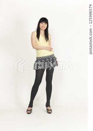 A woman in a black dress 125996574