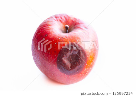 Rotten red apple 125997234