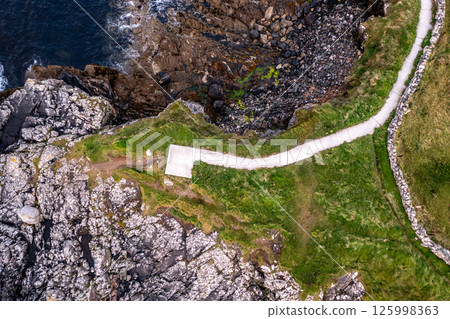 Aerial view of the new path at Portnoo harbour in County Donegal, Ireland. 125998363