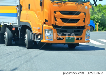 Image of a truck turning right at an intersection Image of a truck turning right at an intersection 125998634