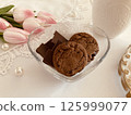 Pink tulips, cookies and chocolate 125999077