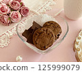 Pink roses, cookies and chocolates 125999079
