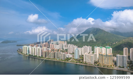 Waterfront Cityscape with High Rise Buildings and a Mountainous Backdrop May 4 2025 Waterfront Cityscape with High Rise Buildings and a Mountainous Backdrop May 4 2025 125999599