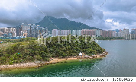 Coastal View of Island with Urban and Mountain Backdrops May 4 2025 Coastal View of Island with Urban and Mountain Backdrops May 4 2025 125999629