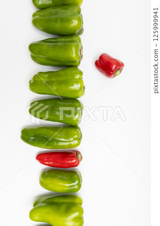 Stock photo of bell peppers: Red bell peppers surrounded by greenery Stock photo of bell peppers: Red bell peppers surrounded by greenery 125999941