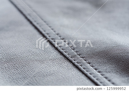 Closeup full grain gray brown leather clothes background 125999952
