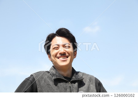 Young man laughing out loud lifestyle image Young man laughing out loud lifestyle image 126000102