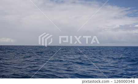 Side view from boat in Indian ocean sailing between Seychelles islands in daytime 126000348