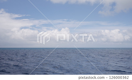Side view from boat in Indian ocean sailing between Seychelles islands in daytime Side view from boat in Indian ocean sailing between Seychelles islands in daytime 126000362