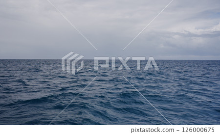Side view from boat in Indian ocean sailing between Seychelles islands in daytime Side view from boat in Indian ocean sailing between Seychelles islands in daytime 126000675