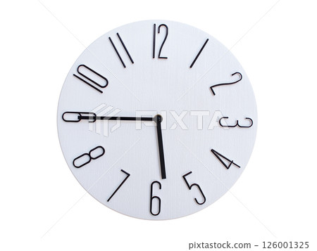 Minimalist Round Wall Clock Showing 05:45 or 17:45. Thin Black Numerals on White Wood Background. Minimalist Round Wall Clock Showing 05:45 or 17:45. Thin Black Numerals on White Wood Background. 126001325