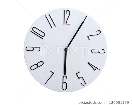 Minimalist Round Wall Clock Showing 06:05 or 18:05. Thin Black Numerals on White Wood Background. Minimalist Round Wall Clock Showing 06:05 or 18:05. Thin Black Numerals on White Wood Background. 126001329