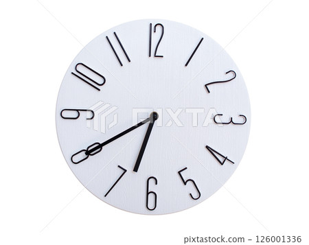 Minimalist Round Wall Clock Showing 06:40 or 18:40. Thin Black Numerals on White Wood Background. Minimalist Round Wall Clock Showing 06:40 or 18:40. Thin Black Numerals on White Wood Background. 126001336