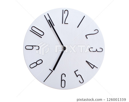 Minimalist Round Wall Clock Showing 06:55 or 18:55. Thin Black Numerals on White Wood Background. Minimalist Round Wall Clock Showing 06:55 or 18:55. Thin Black Numerals on White Wood Background. 126001339